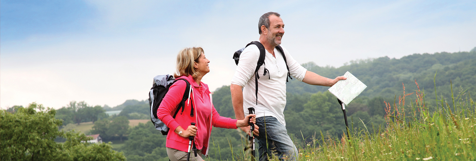 A middle-aged couple on a hike.