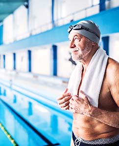 an older man preparing to swim for aquatic PT