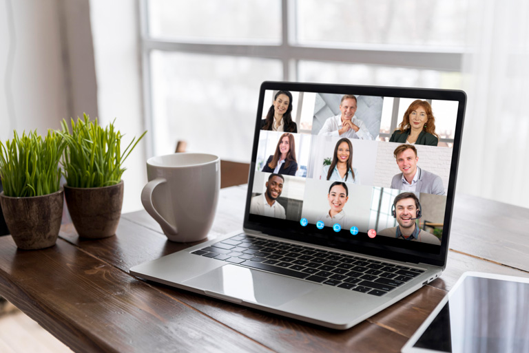 Videocall with 9 persons on a computer over a desktop