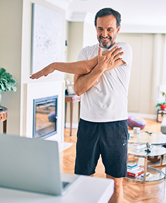 Telehealth stretching man standing up