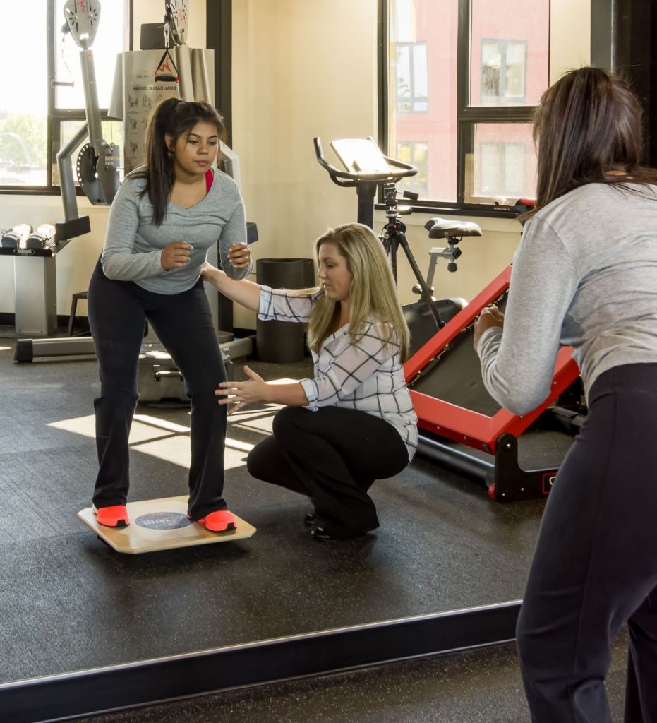 balance exercise in a physical therapy gym