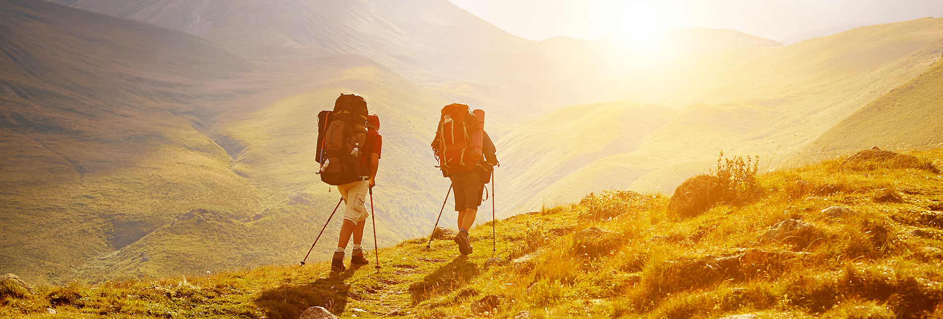 rear view of two people hiking/backpacking