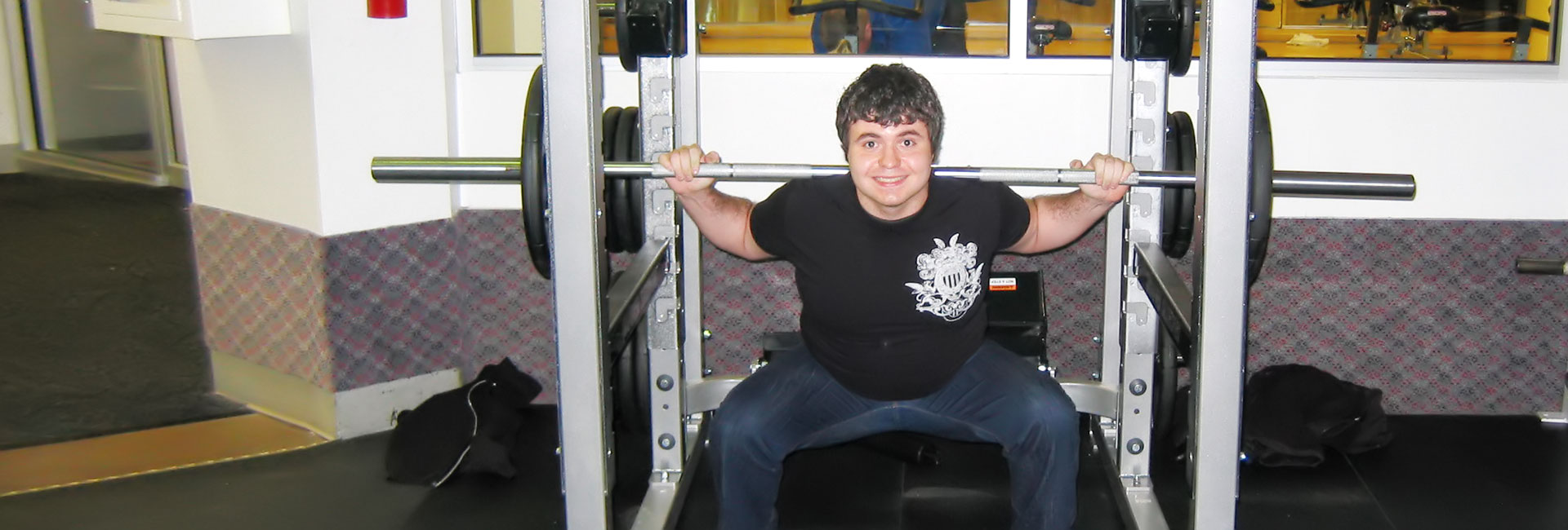 A young man lifting weights