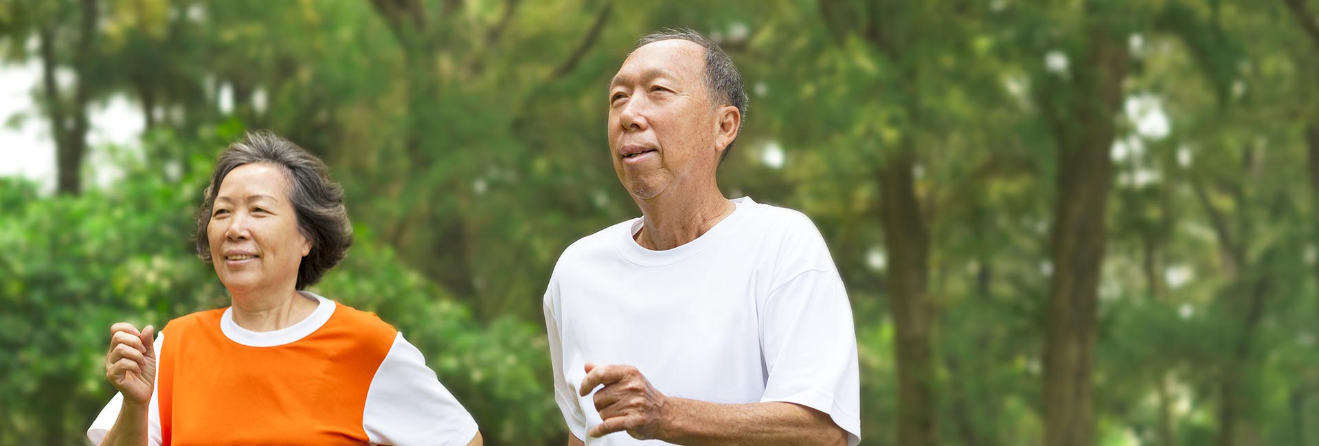 two adults on a run outdoors