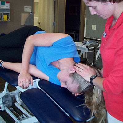 physical therapist works on a patient with vestibular issues