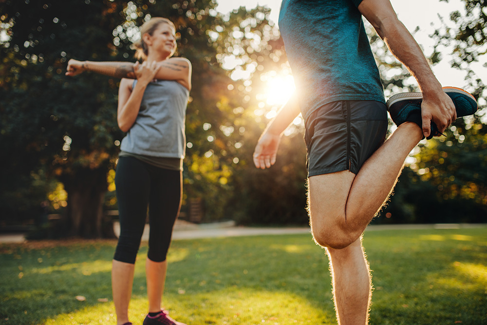 couple stretching outdoors