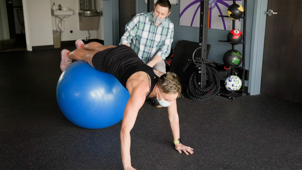 physical therapist works with a patient