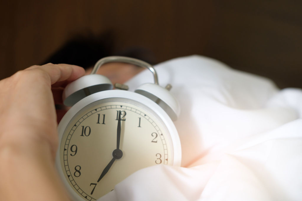 alarm clock as a symbol of sleep needs