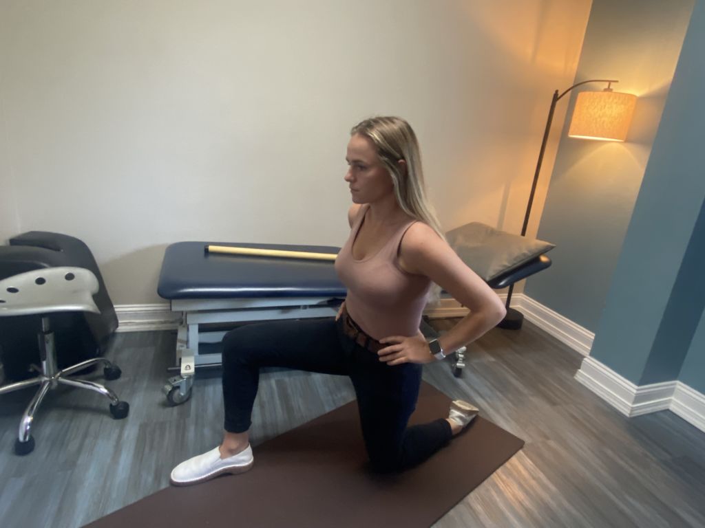woman doing seated hamstring stretch