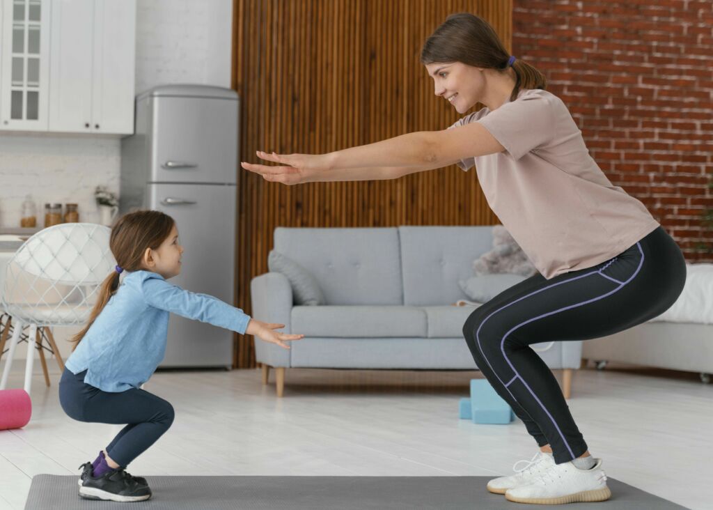 mother daughter doing exercise and squats