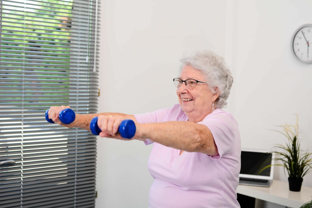 senior woman lifting dumbbells