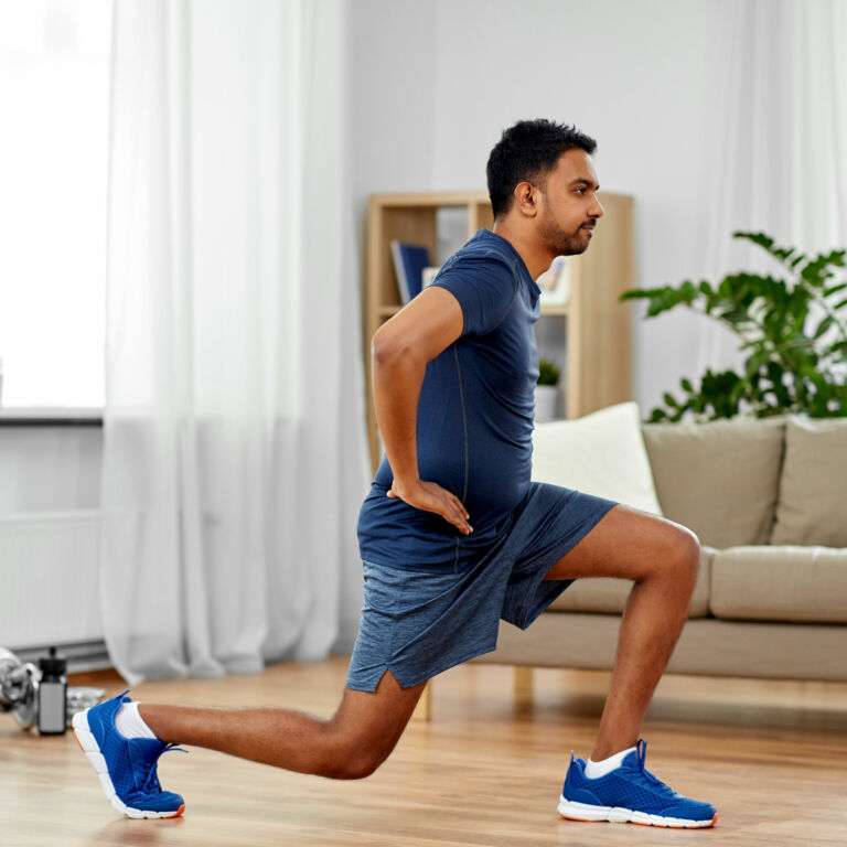 man illustrates how to do a proper lunge exercise