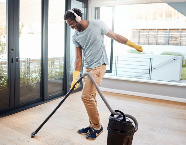 man actively spends time cleaning house
