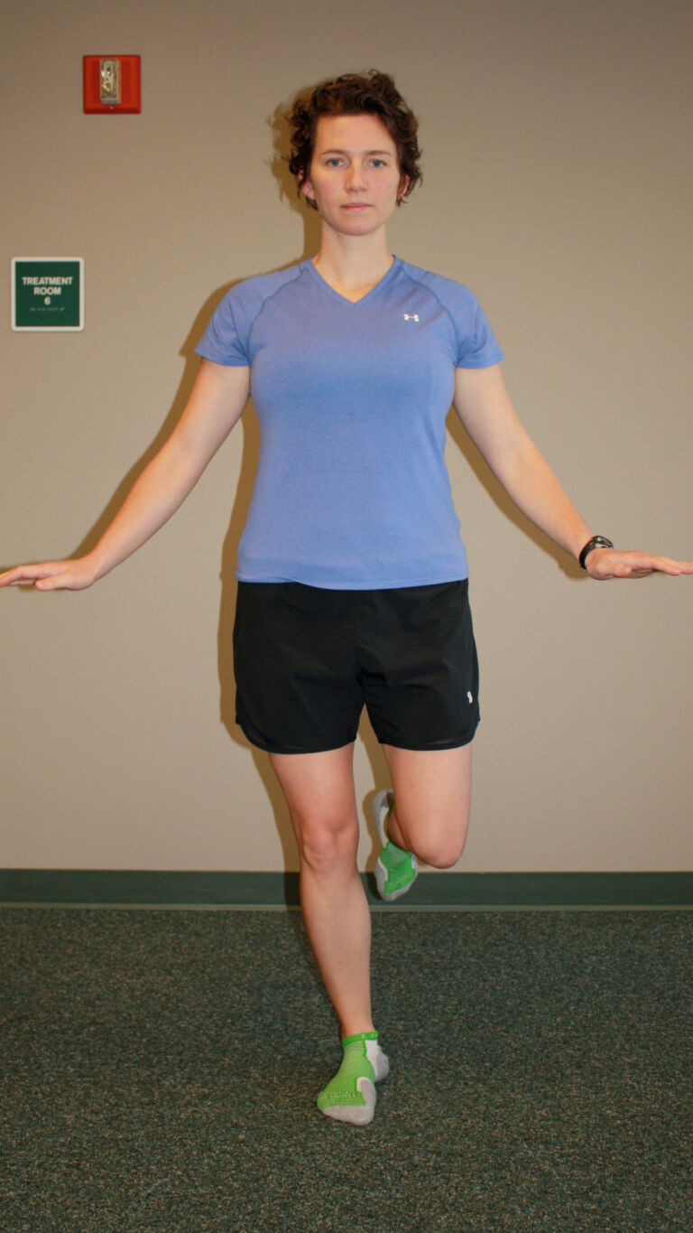 PT demonstrates a single-leg balance exercise