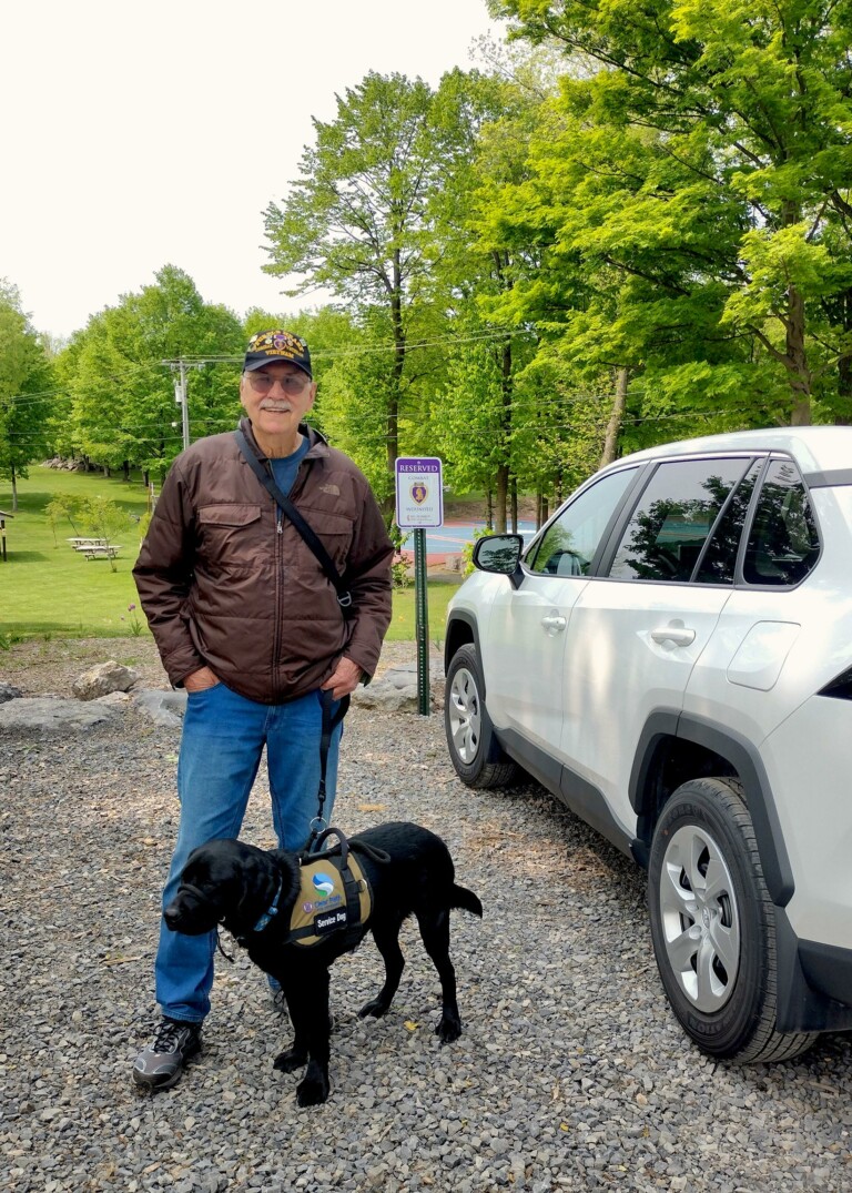 Vietnam Veteran Jim Klug and service dog Niko arrive at Clear Path for Veterans