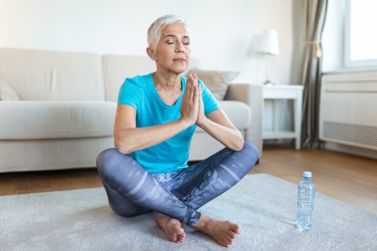 senior woman practices breathing, an important aspect of health during menopause