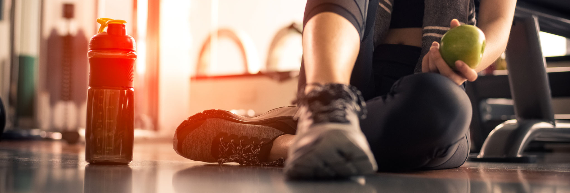 After a workout in the gym, a person sits down to recover