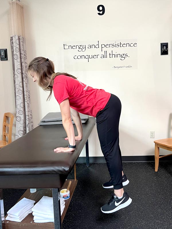 holding a bench or counter is a great way to practice jumping for exercise with balance support
