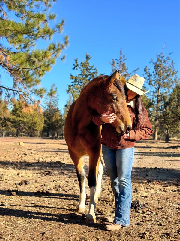 a young woman spends time bonding with her horse