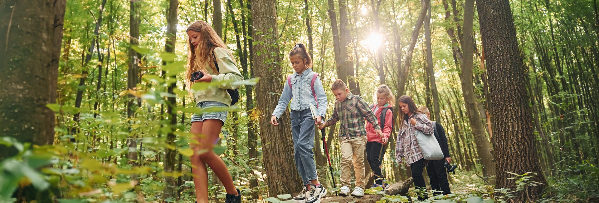 A group of children walking together in nature