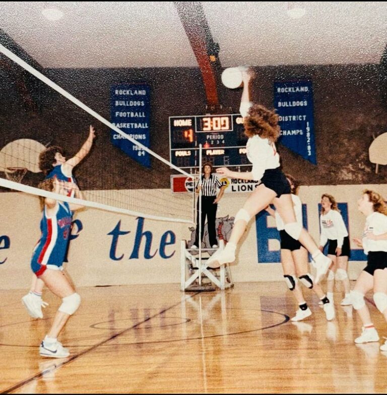 a snapshot of a volleyball game in the 80s