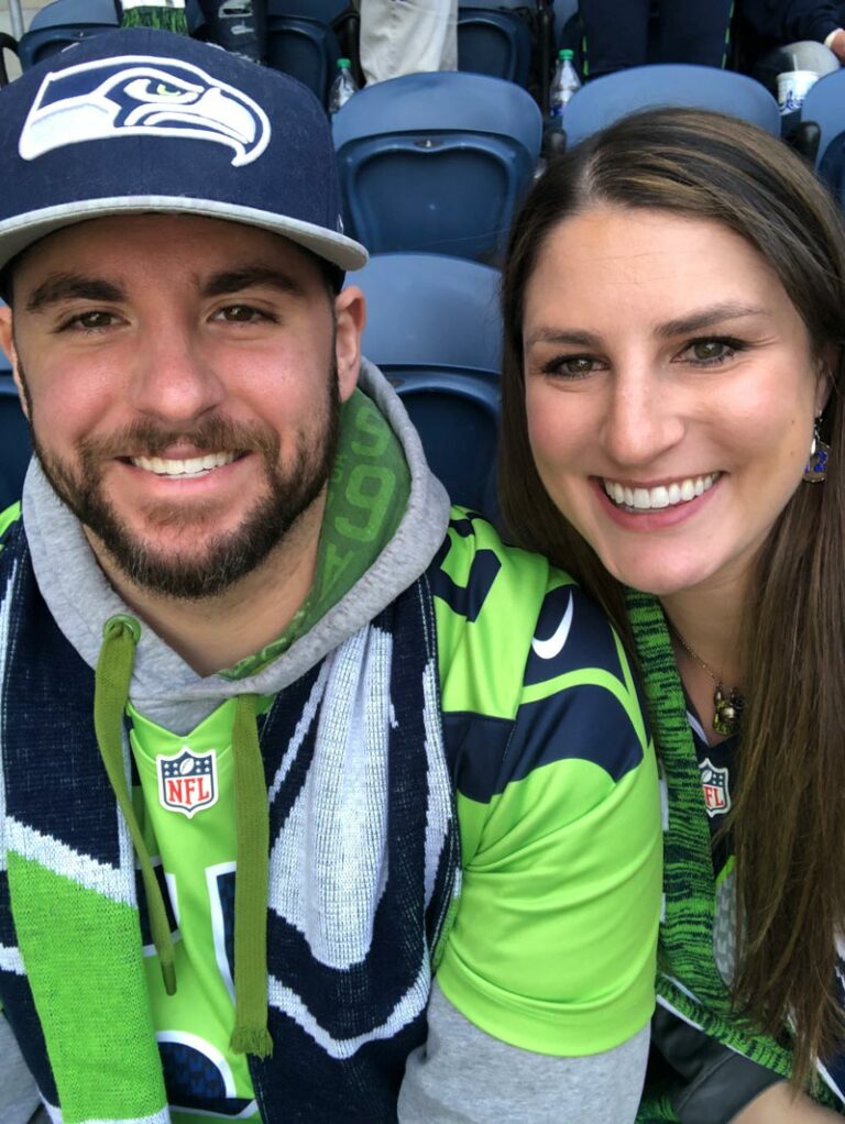 At a Seahawks game as football fans!