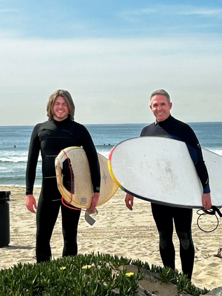 PT Rob Barnes and his son enjoy surfing
