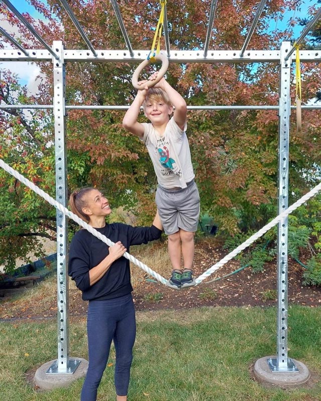 PT Katie Duke with her son playing outdoors