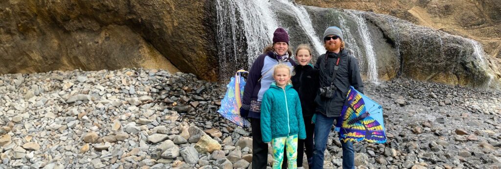 Jason Quigley and his family on an outing together near a waterfall
