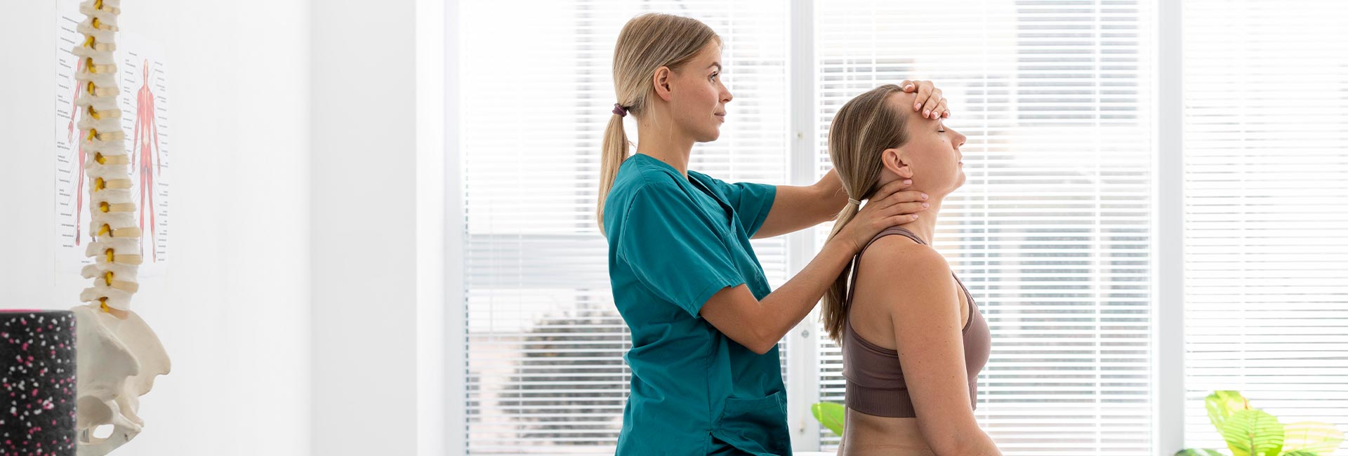 A medical provider works on a patient's neck in a medical office