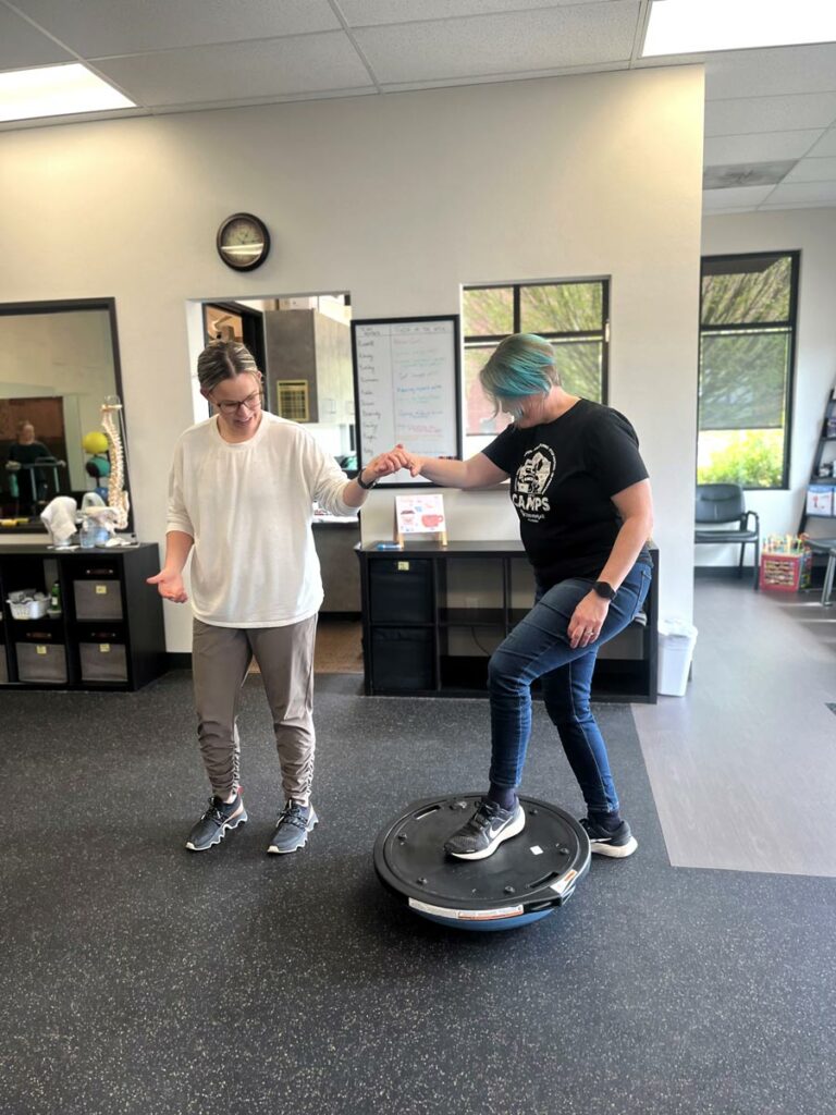 PT Bailey Ouelette works with ankle rehab patient Cindy Davidson in Hillsboro