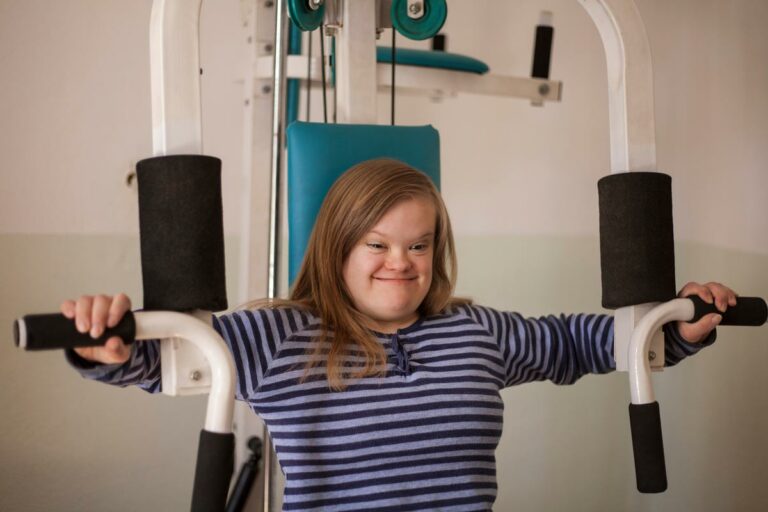 young woman using gym equipment for strength training